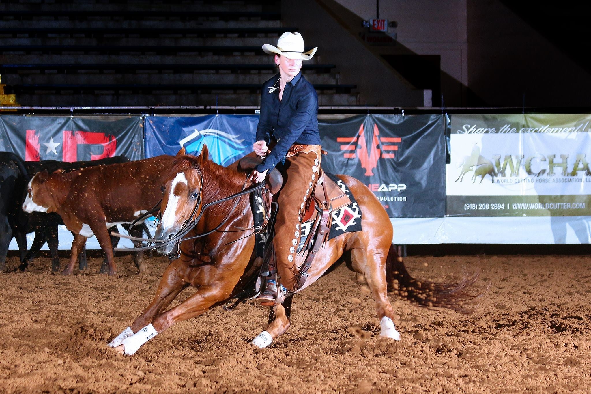 Astrid von Krenski competing on a cutting horse at the WCHA Qualifiers in Ardmore, Texas.