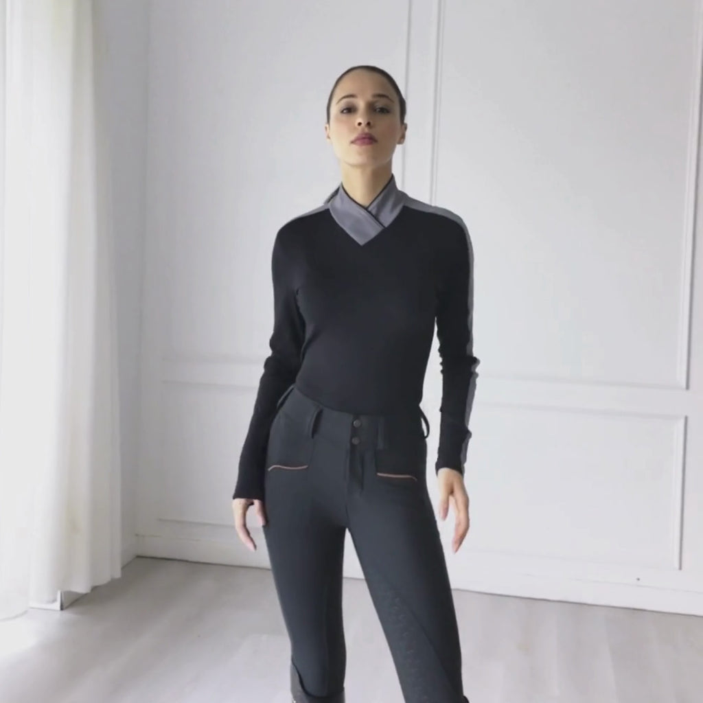 Discover the Uniqcorn Éco Long Sleeve Sun Shirt in Onyx, featuring UPF 50+ protection, ultra-soft bamboo performance fabric, full ombré mesh sleeves for enhanced ventilation, and an elegant silhouette designed for riding and beyond.